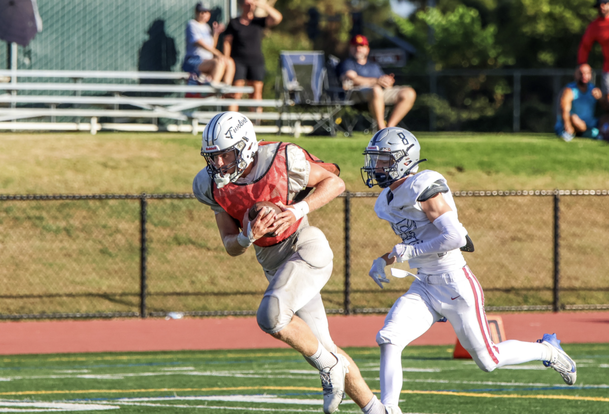 GO FOR THE GOAL: Senior Joseph Harper scores a touchdown during a padded scrimmage as the football team prepares for new schools and competition to be added to the Foxtrot League.